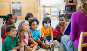 Young students following along with their teacher during class